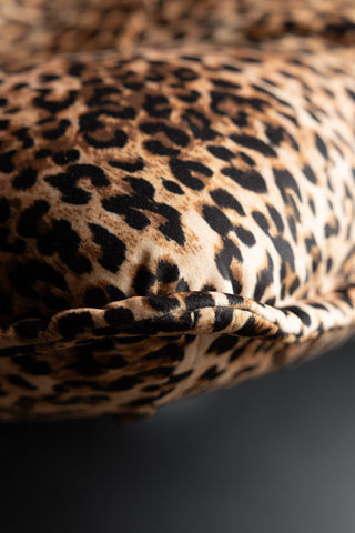 Close-up of the edge of the Leopard Print Velvet Swivel Chair.