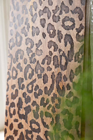 The etched leopard print detailing on the Leopard Print Tall Wooden Serving Board. 