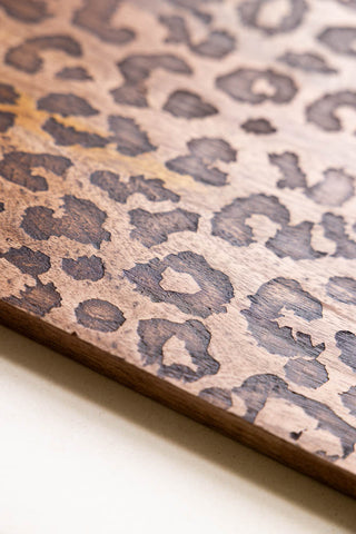 The side of the Leopard Print Tall Wooden Serving Board, showing the leopard detailing. 