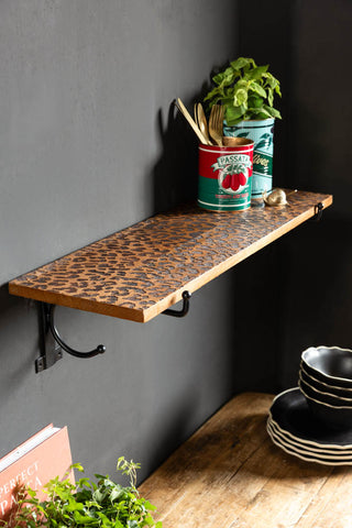 Lifestyle image of the Leopard Print Wooden Shelf With Bracket