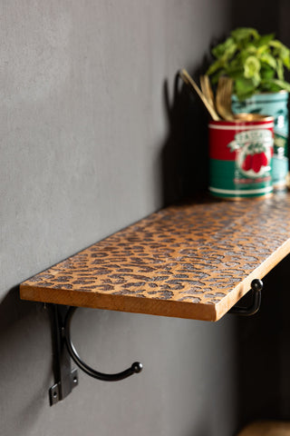 Image of the Leopard Print Wooden Shelf With Bracket on a wall