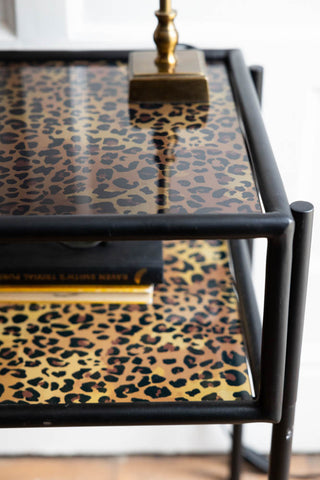Close-up image of the Leopard Print & Glass Bedside Table
