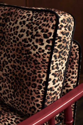The leopard seat cushion with black velvet piping on the Leopard Print & Red Rebel Spindle Armchair.