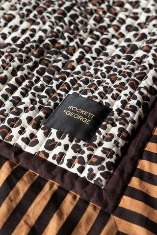 Image of the logo on the Leopard Print & Striped Reversible Quilt
