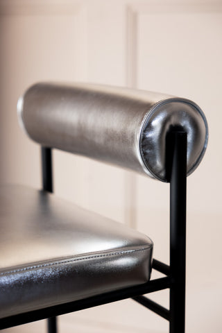 Close-up image of the Metallic Silver Roll Back Bar Stool