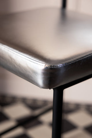 Image of the finish on the Metallic Silver Roll Back Bar Stool