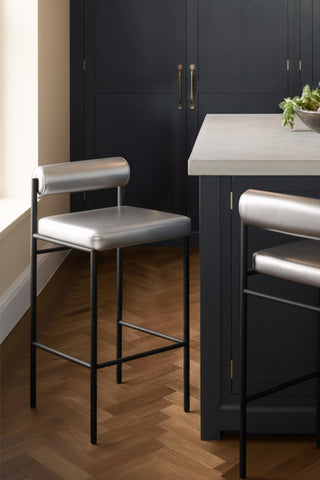 Image of the Metallic Silver Roll Back Bar Stool in a kitchen setting.