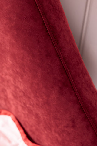 The piping on the headboard of the Lips Bed in Cherry Red Needlecord Velvet. 