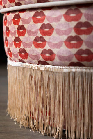 Close-up of the tassel edge on the Lips Tassel Swivel Chair.