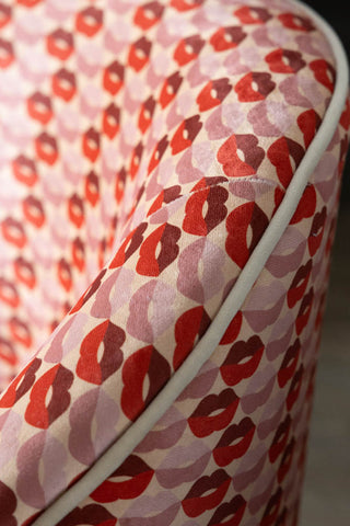 Close-up of the piped edge on the Lips Tassel Swivel Chair.