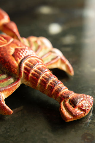 Close-up of the tail of the Lobster Cast Iron Boot Jack.