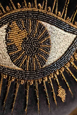 A detail shot of the embroidery of the eye of the Look Of Love Embroidered Black Velvet Cushion