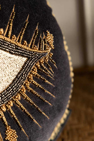 Close up of the corner of the eye on the Look Of Love Embroidered Black Velvet Cushion