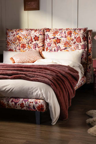 The Lounge Lover Bed in Charleston Garden Velvet - shown against a panelled wall. 