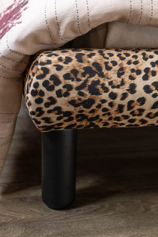 A close up detail showing the end of the Lounge Lover Bed in Leopard Print Velvet. 