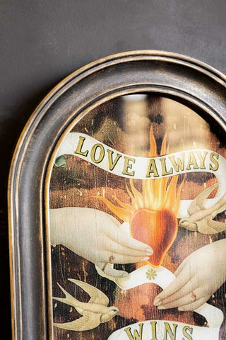 Close-up of the top of the Vintage-Style Love Wins Framed Wall Art.