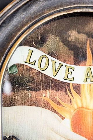 Close-up of the text on the Vintage-Style Love Wins Framed Wall Art.