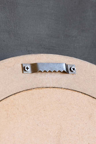 Close-up of the hook on the back of the Vintage-Style Love Wins Framed Wall Art.