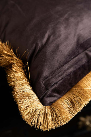 Close-up of the reverse side of the cortner of the Love Always Wins Fringed Velvet Cushion.