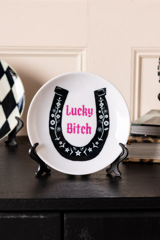 Image of the Lucky Bitch Decorative Wall Plate on a stand