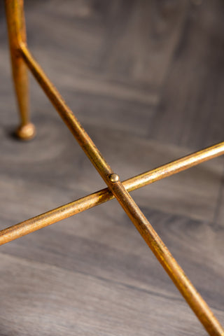 The table leg detail of the Lucky Clover Mirrored Side Table. 