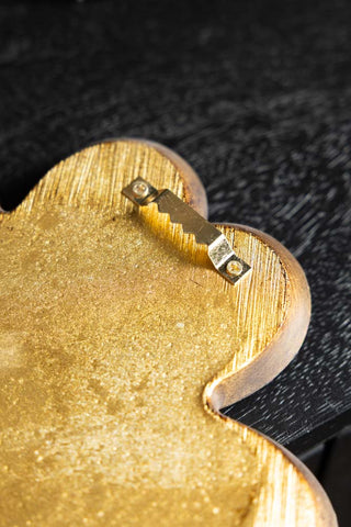 The fixing on the back of the Lucky Clover Small Gold Wall Mirror. 