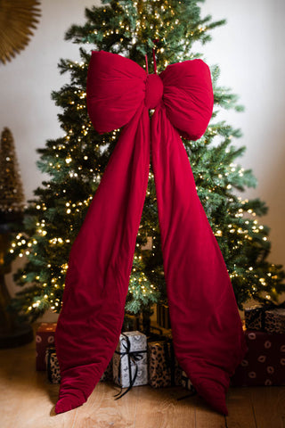 Image of the Luxurious Red Velvet Bow Christmas Decoration - Extra Large on a tree