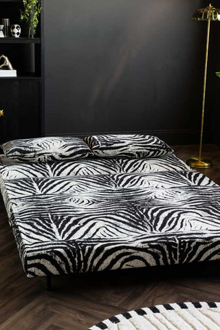 The Mabel Large 2 Seater Sofa Bed in Zebra Print Velvet shown flat in bed mode. 