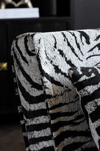 The corner detail of the Mabel Large 2 Seater Sofa Bed in Zebra Print Velvet. 