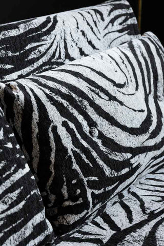 Detail showing the buttoned cushions on the Mabel Large 2 Seater Sofa Bed in Zebra Print Velvet. 