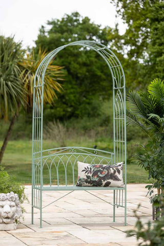 Lifestyle image of the Mint Green Garden Bench With Arch
