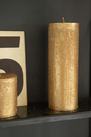 Lifestyle image of the Metallic Gold Shimmer Pillar Candle - Large
