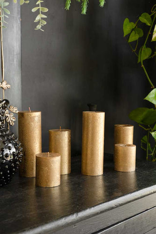 Image of the Metallic Gold Shimmer Pillar Candle - Medium showing different sizes