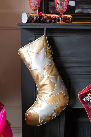 Lifestyle image of the Metallic Gold & Silver Star Christmas Stocking