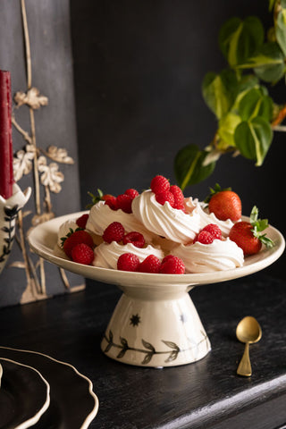 Lifestyle image of the Milagro Heart Ceramic Cake Stand