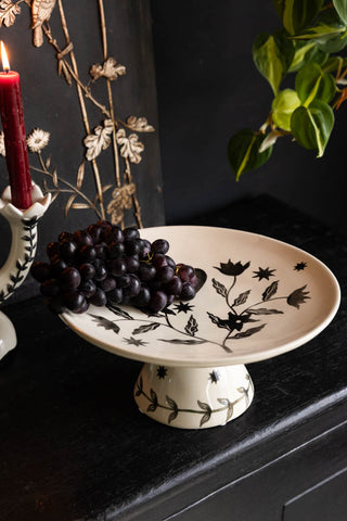 Image of the Milagro Heart Ceramic Cake Stand on a sideboard
