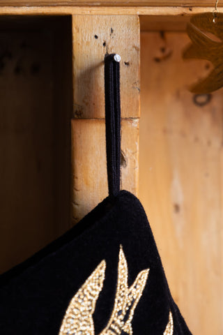 Image of the Milagro Red & Gold Embroidered Christmas Stocking hanging