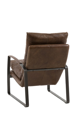The Minimalist Brown Leather Lounge Chair seen from the back, on a white background.