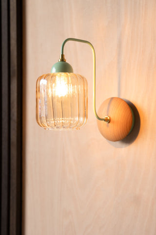 Lifestyle image of the Mint Green Metal & Ribbed Glass Wall Light on