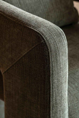 Close-up of the artm of the Modern Green Accent Chair with Bolster Cushion.