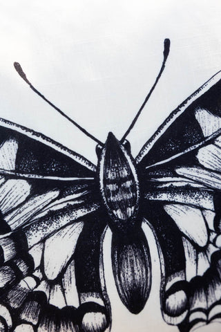 Close-up of the design on the Monochrome Butterfly Outdoor Cushion.