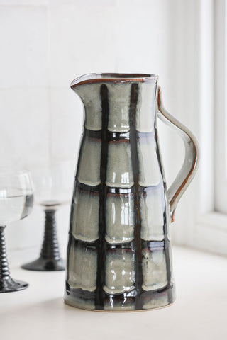 Lifestyle image of the Black & White Checkered Water Jug