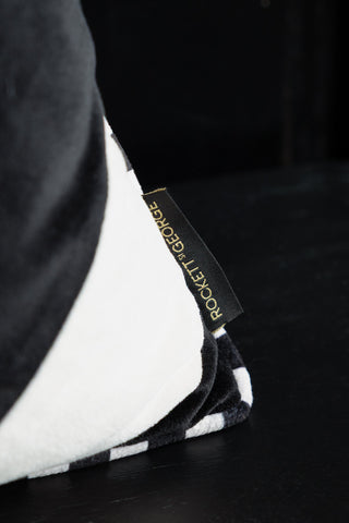 Image of the logo on the Monochrome Diagonal Stripe Velvet Cushion