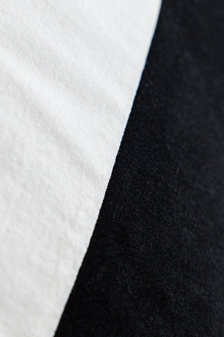 Close-up image of the Monochrome Diagonal Stripe Velvet Cushion