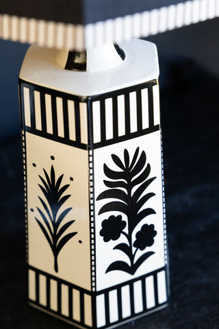A detail image of the folk floral pattern on the base of the Monochrome Folklore Floral Table Lamp. 
