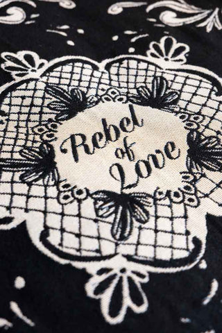 Detail of the centre "rebel of love" pattern on the Monochrome Forever Rebel Woven Throw. 