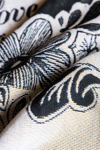 A detail  image showing the weave and pattern of the Monochrome Forever Rebel Woven Throw. 