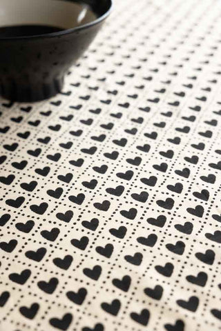 Close-up image of the Monochrome Heart Cotton Tablecloth