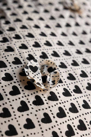 Close-up image of the Monochrome Heart End Of Bed Throw