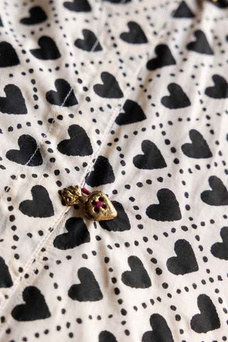 Image of the buttons on the Monochrome Heart End Of Bed Throw